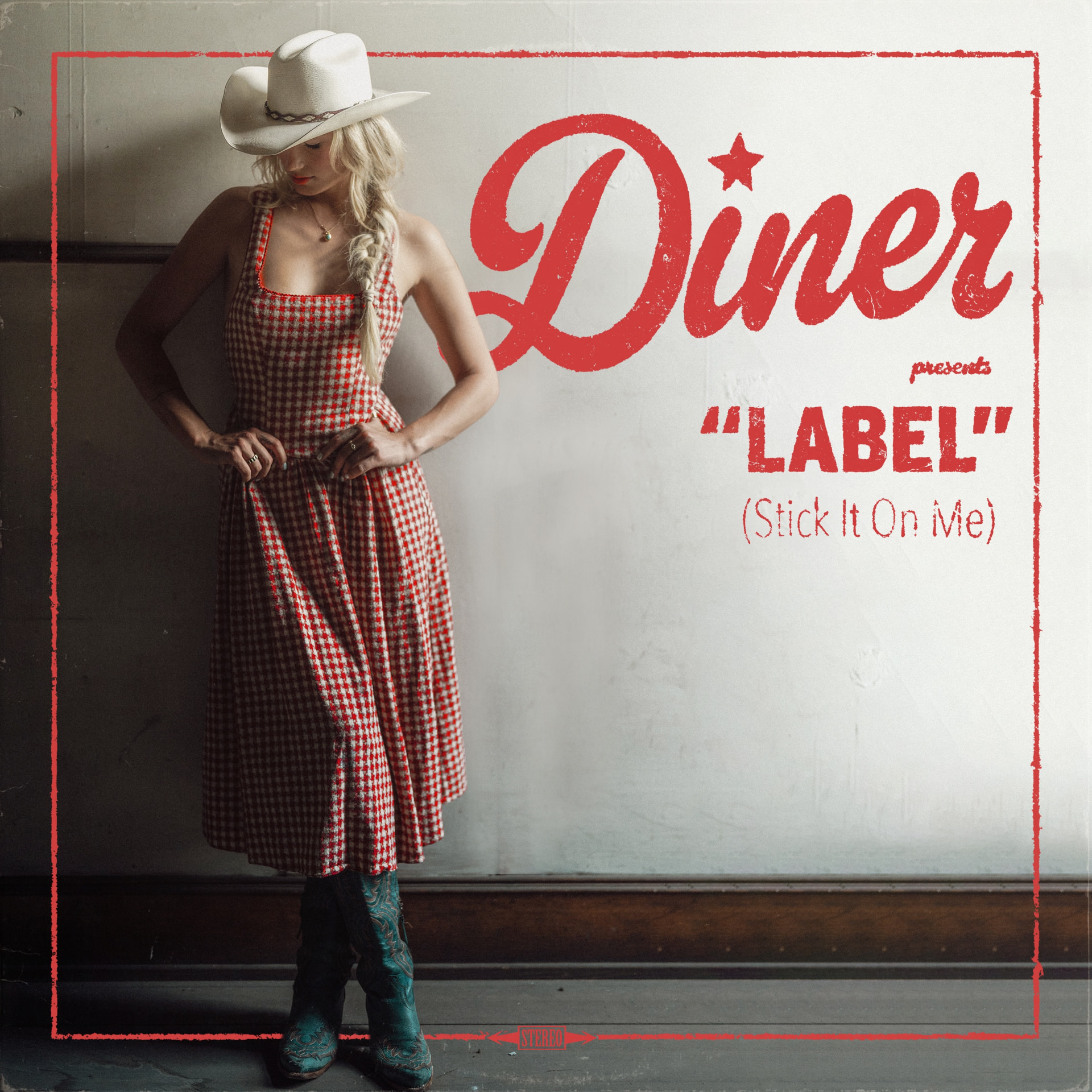 Album art for Diner's 'Label (Stick It On Me)': a woman in a white cowboy hat and red gingham dress leaning against a paneled wall, the title printed in red script beside her.